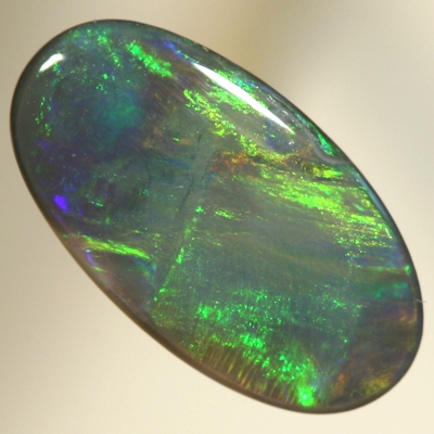 SOLID BLACK OPAL Golden gem fire, oranges and greens with a touch of blue. SEE VIDEO